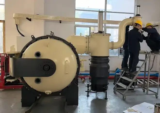 Vacuum furnace system installation with technicians assembling vacuum piping and exhaust components.