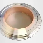 Components made of copper and stainless steel are joined together using a vacuum brazing process