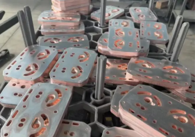 Copper and stainless steel assemblies undergoing vacuum brazing to form a high-end water-cooled heat exchange plates for AI servers